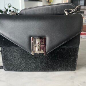 Henry Bendel of New York, Black leather purse with fur